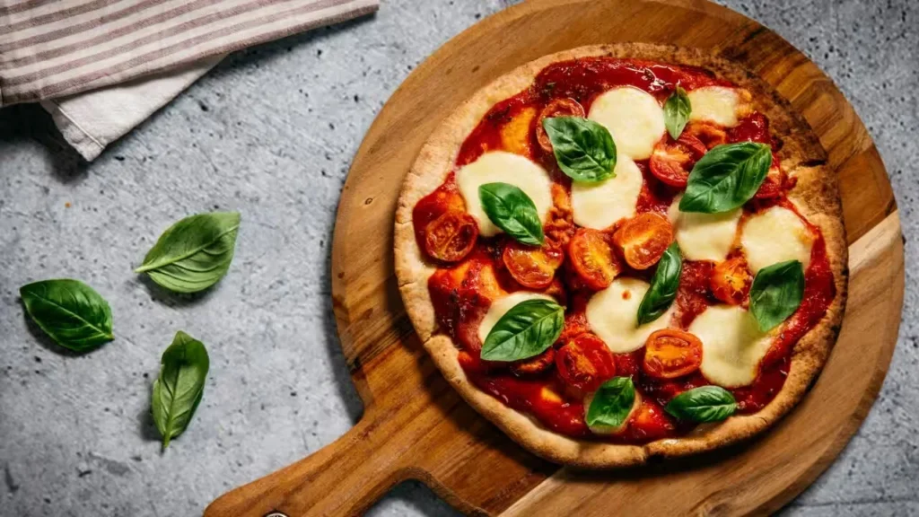  Fresh Margherita pizza served as part of an Italian set lunch in Singapore with mozzarella, basil, and cherry tomatoes