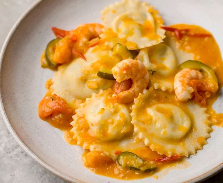  Seafood ravioli Singapore dish in rich tomato sauce.